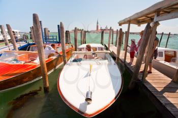 VENICE, ITALY- JUNE 23: boarding in water taxi  on San Marco canal on June 23, 2011 in Venice, Italy