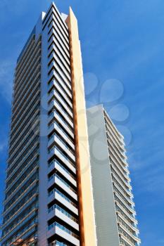 tall modern multistory house under blue sky
