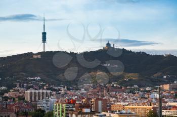 Tibidabo Mountain with TV tower and Expiatory Church in Barcelona in evening