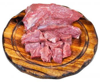 cut raw beef meat on wooden board isolated on white background