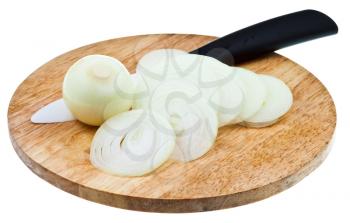 bulb and sliced onions with ceramic knife on wooden cutting board isolated on white background