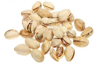 many salted pistachio nuts close up isolated on white background