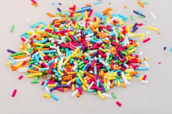 heap of decorating colored sugar jimmies on table