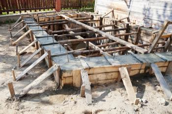 wooden formwork concrete foundation of house at building yard