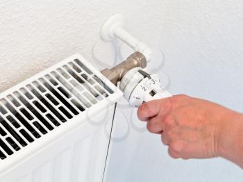 adjusting of home temperature by rotation of the radiator thermostat