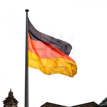 State Flag of Germany over Reichstag building tower in Berlin