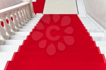 red carpet on white marble staircase