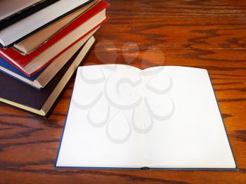 above view of blank open book on wooden table