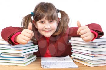 glad schoolgirl did schoolwork and shows thumb-up