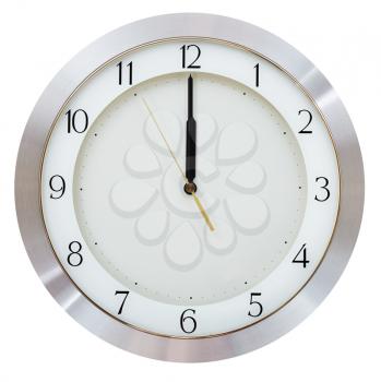 without five seconds twelve o clock on the dial round wall clock