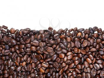 flat level from roasted coffee beans close up on white background