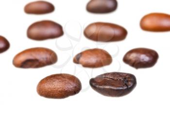 rows from roasted coffee beans with focus foreground