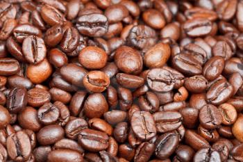 background from light roasted coffee beans close up