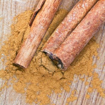sticks and powdered Cinnamon spice close up