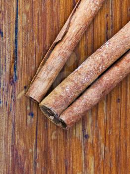 top view of Cinnamon sticks spice close up on wooden table