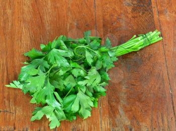 fresh green parsley on wooden table