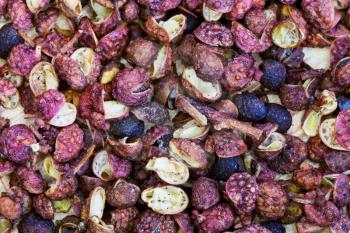 background from dried pods of Sichuan pepper close up