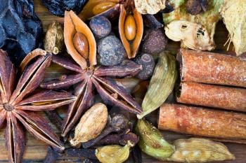 macro view of various spices for mulled wine on wooden table