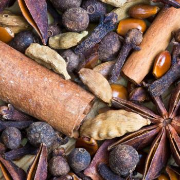 background from dried spices for mulled wine close up