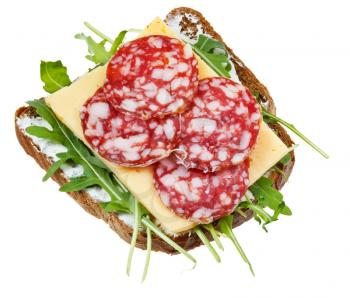 sandwich from rye bread, salami, cheese and rocket salad isolated on white background