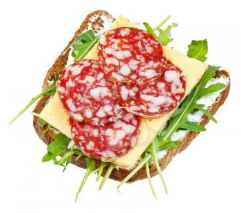 sandwich from rye bread, salami, cheese and fresh arugula isolated on white background