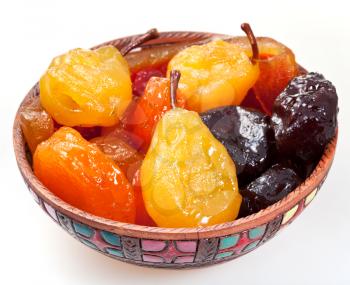 armenian sugared sweet fruits in ceramic bowl isolated on white background