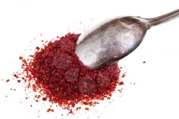 spoon and ground sumac spice close up