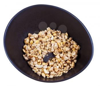 dried muesli with raisin and nuts in black bowl