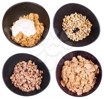 set of top view cereal in dark bowl isolated on white background