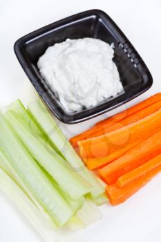 vegetables with Blue cheese dressing on white plate