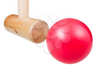 croquet wooden mallet strikes red ball close up isolated on white background