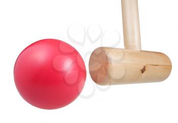 croquet mallet hits ball close up isolated on white background