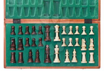 top view of set of chess pieces packed in box close up
