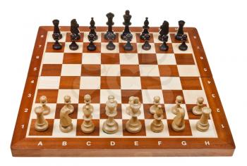 chess pieces placed on board isolated on white background