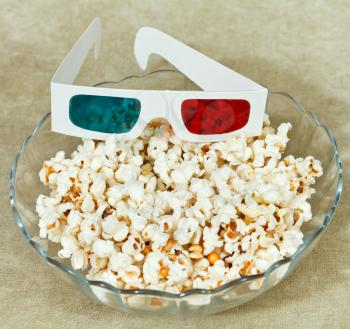 anaglyph 3D stereo glasses in bowl with popcorn