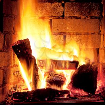 burning wood in fireplace in evening time