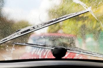 Car wipers clean windshield when driving in bad weather
