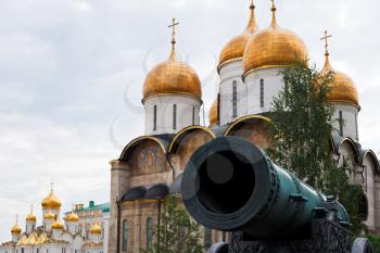 Tsar Cannon and gold cupola of Cathedrals in Moscow Kremlin