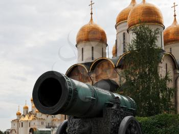 view of Tsar Cannon and gold dome of Dormition Cathedral in Moscow Kremlin