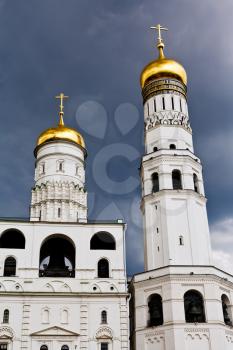 facade of Ivan the Great Bell Tower and Assumption belfry in Moscow Kremlin in rainy day