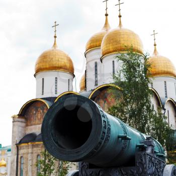 Tsar Cannon barrel and gold dome of Dormition Cathedral in Moscow Kremlin