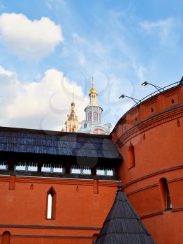 towers of Zaikonospassky monastery over old Kitay-gorod wall in Moscow