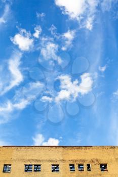 blue sky with white cloud above furbished building in summer day