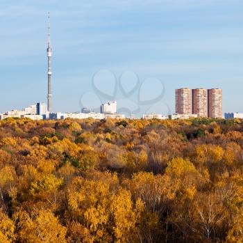 Moscow view with TV tower, houses and autumn trees and blue afternoon sky