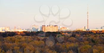 Moscow skyline with TV tower and pink autumn sunset over forest
