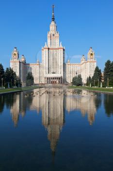main building of Lomonosov Moscow State University and fountain pond in summer day