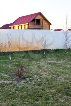 new backyard of country village in spring evening
