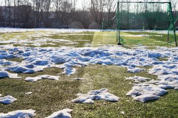 snowdrift on sport game at outdoor soccer field in low season