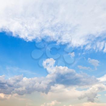 cloudscape with stratus clouds in blue sky in spring evening