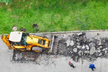 top view of tractor removes asphalt from road